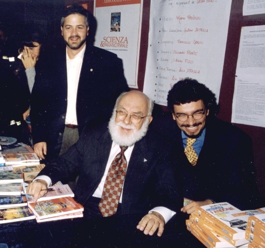 Two laughing Randi and Massimo watched by Marco Ferruccio.